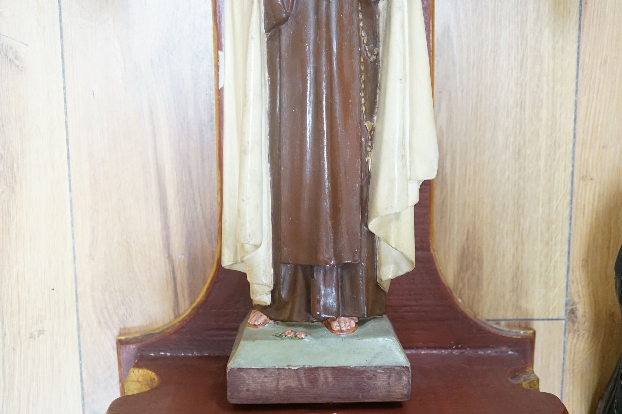 A carved gilt niche with a carved painted Madonna, 68cm